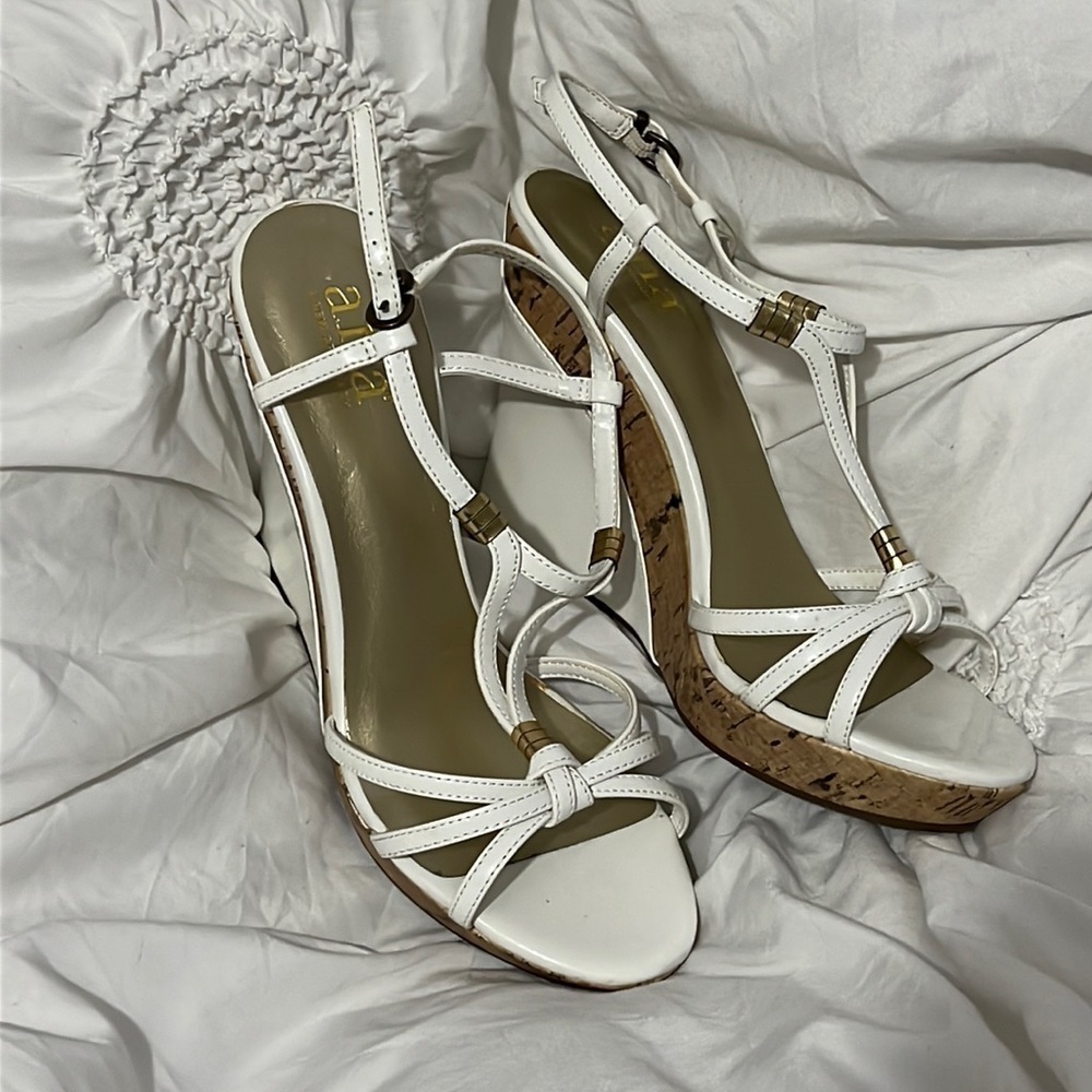 White and gold cork wedge heel.